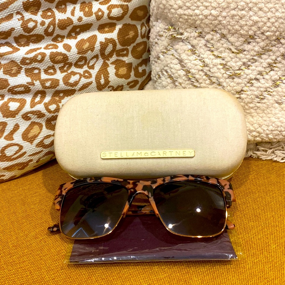 Stella McCartney sun glasses with case and cleaning cloth.